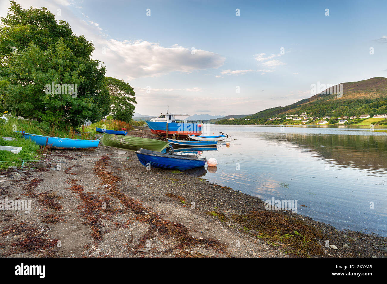 Fishing boats on the shore at Portree on the Isle of Skye in Scotland Stock Photo