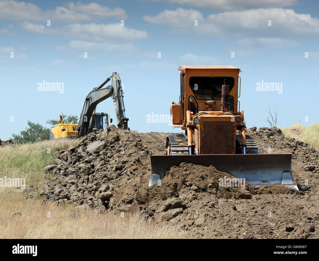 bulldozer and excavator on road construction Stock Photo