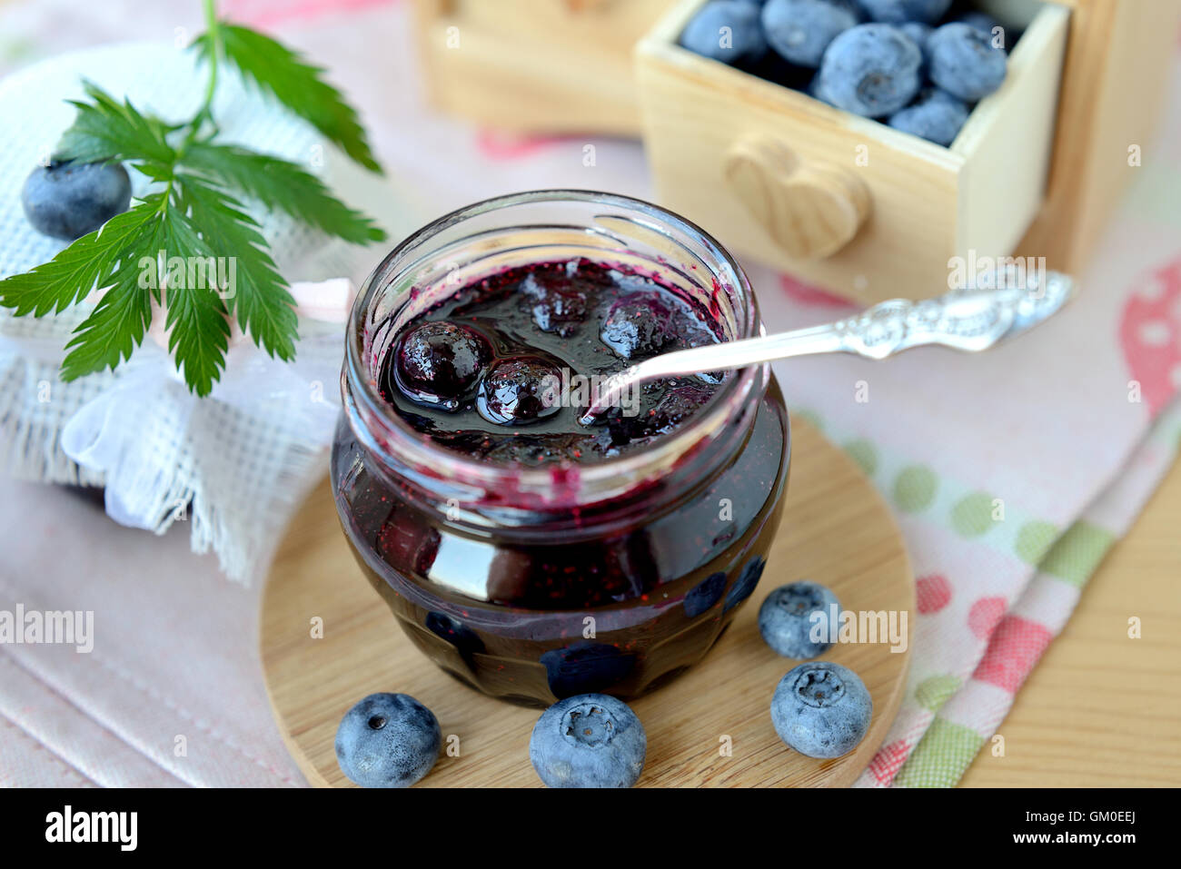 Two jars of just brewed jam made of blueberry Stock Photo