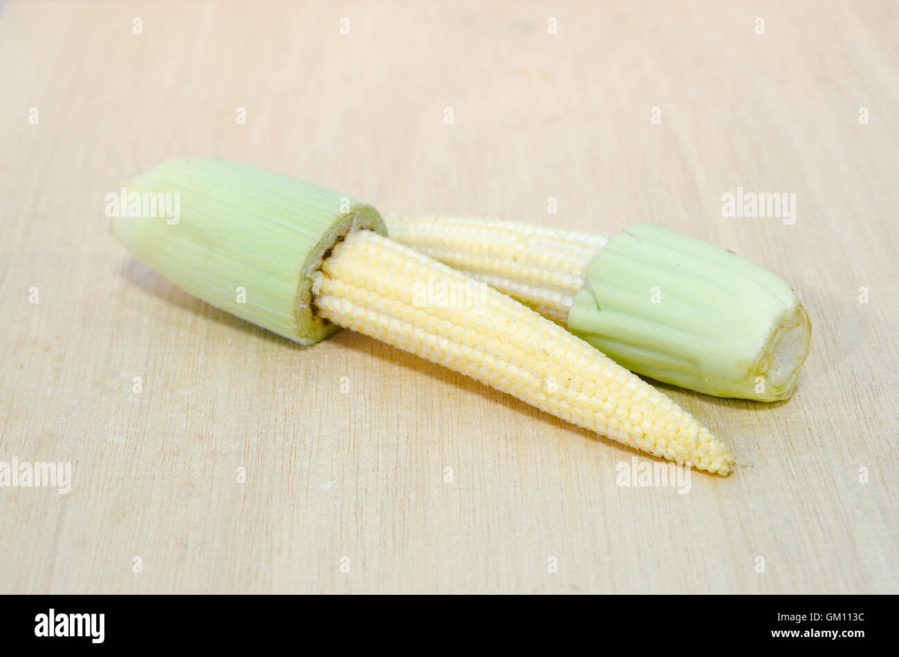 Baby corn fruit (also known as young corn, mini corn, cornlettes, candle corn, Zea mays L, Gramineae) grouped and isolated on wo Stock Photo