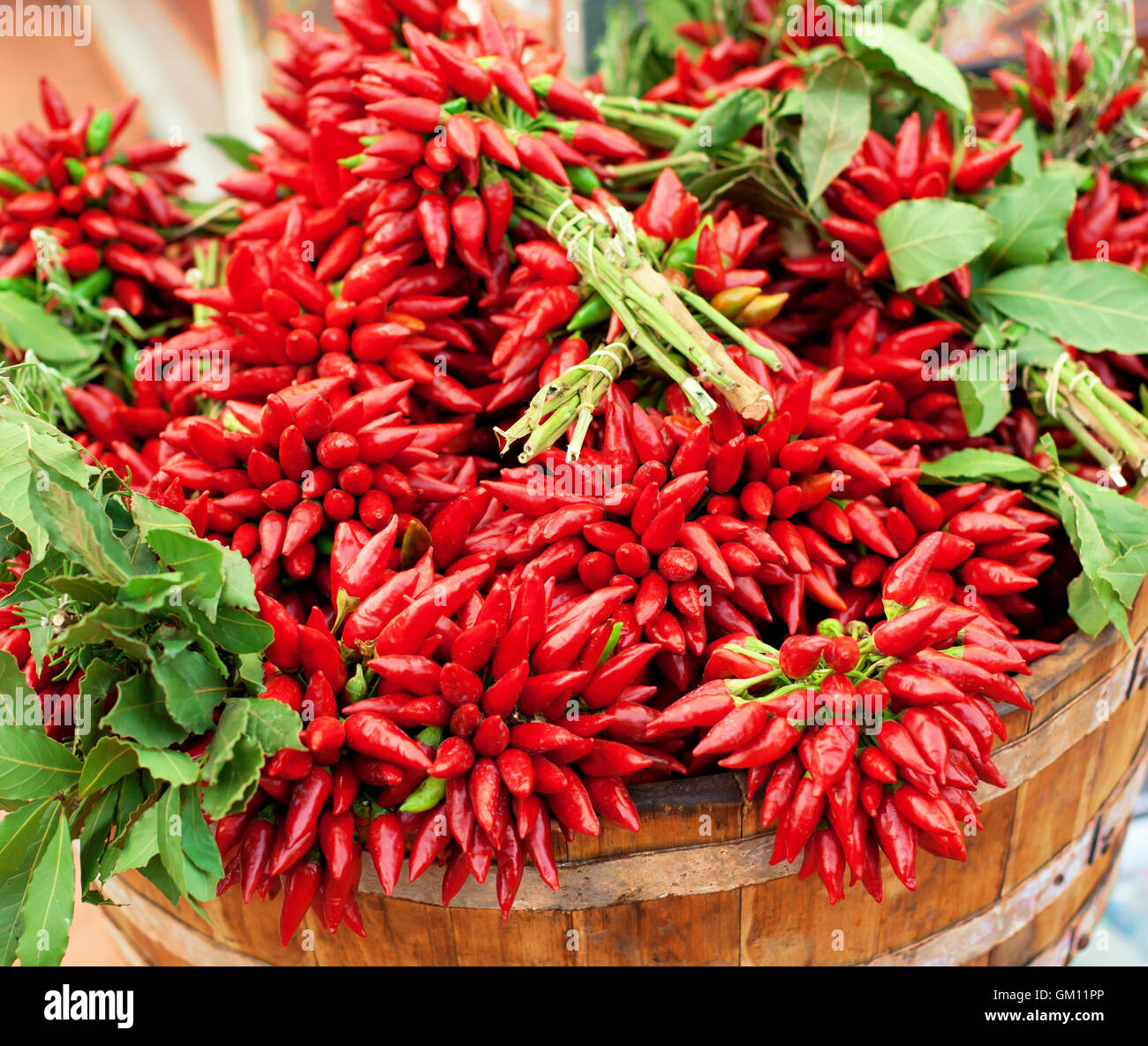Big bunch of red hot chili peppers at outdoors market Stock Photo - Alamy