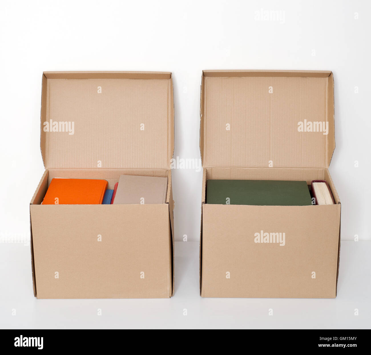 cardboard boxes full of books Stock Photo Alamy