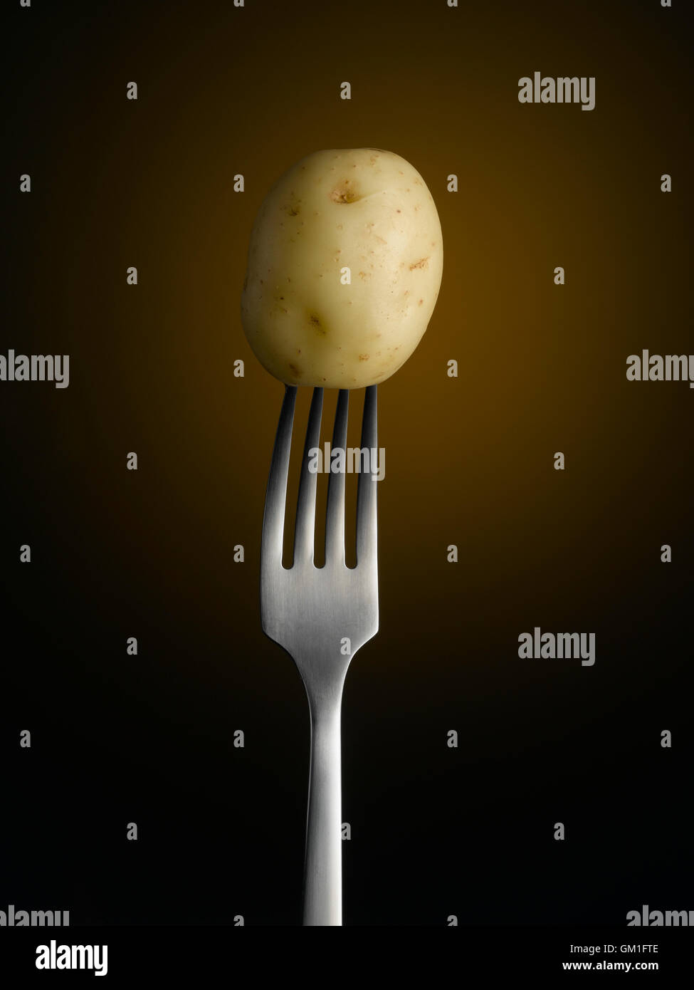 New Potato on Fork Stock Photo