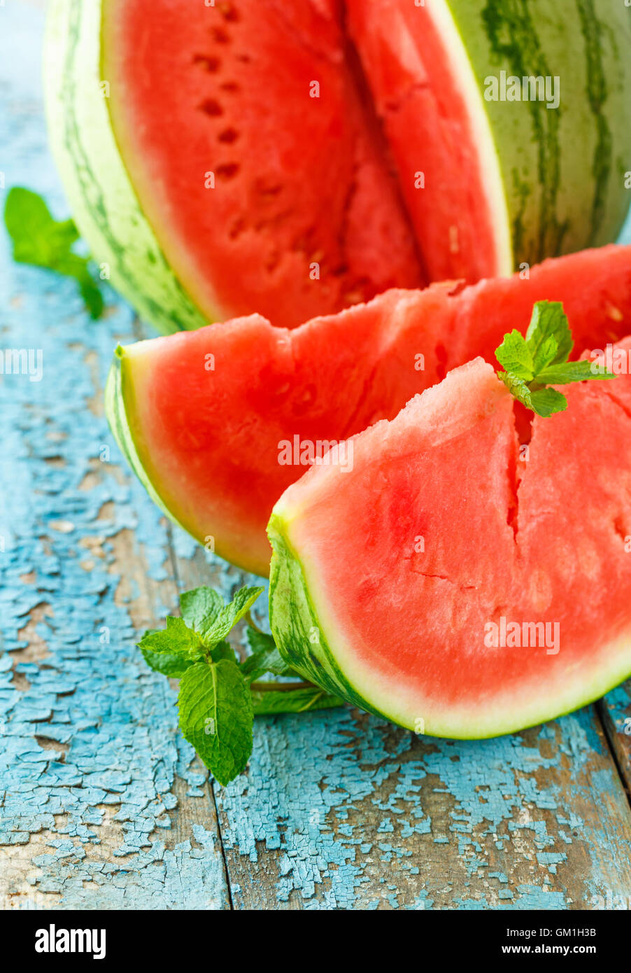 Fresh watermelon sliced with mint close up on the table Stock Photo