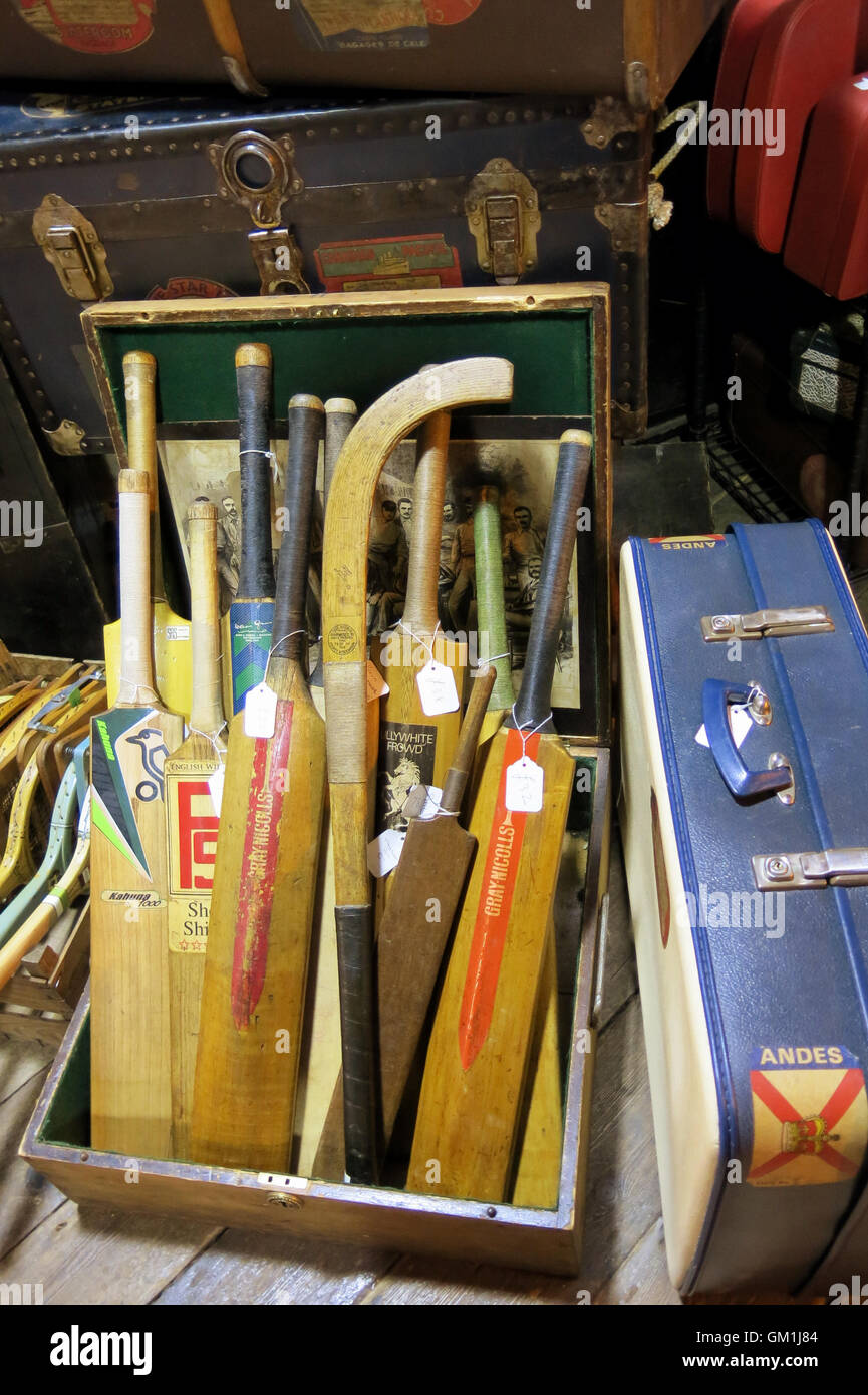 CAMDEN market Old and used hand bat for cricket and sticks for field hockey Stock Photo