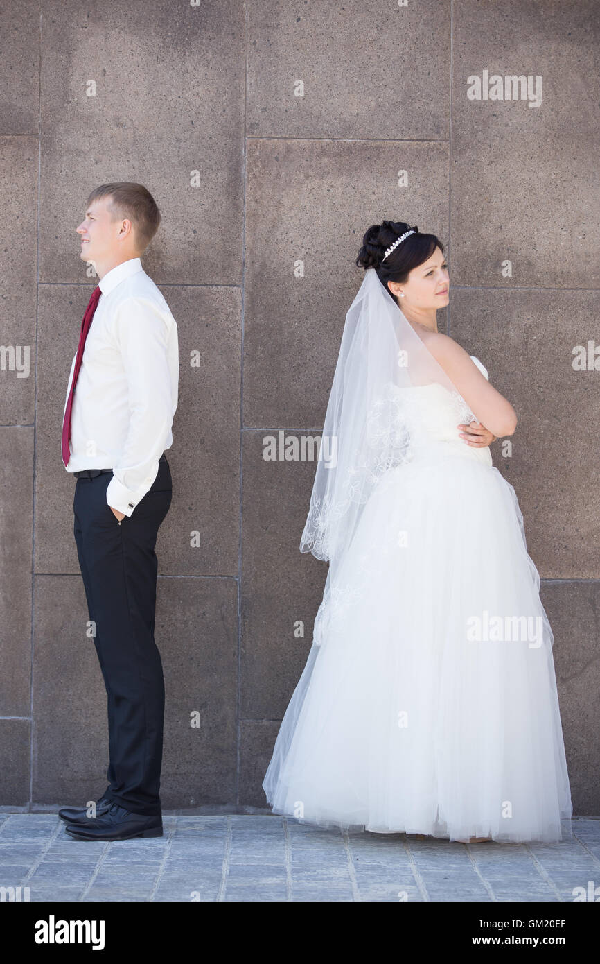 Unhappy newlyweds argue, having relationship difficulties. Marital problems concept. Couple after an argument ignoring each othe Stock Photo