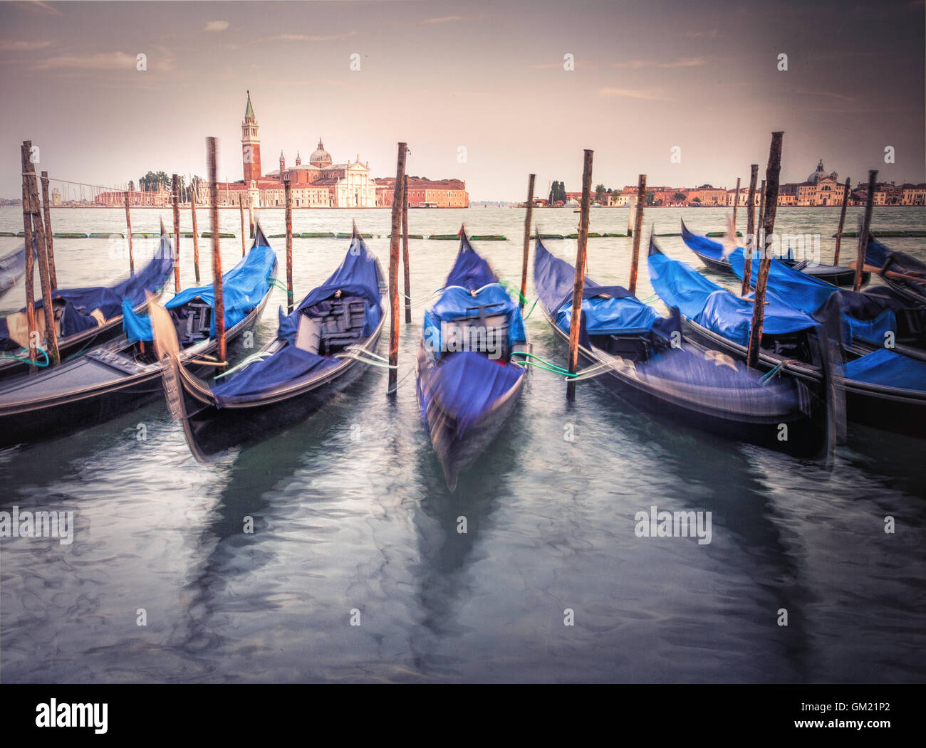 Gondolas on lagoon Venice Italy with San Giorgio Maggiore church in background Stock Photo