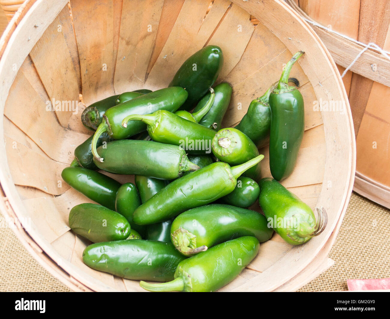 Jalapeno chili peppers in basket Stock Photo Alamy