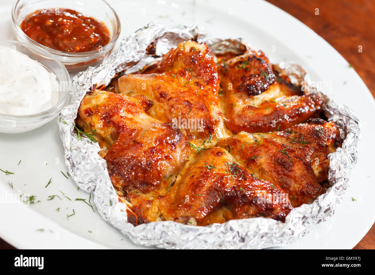Chicken wings with sauce Stock Photo - Alamy