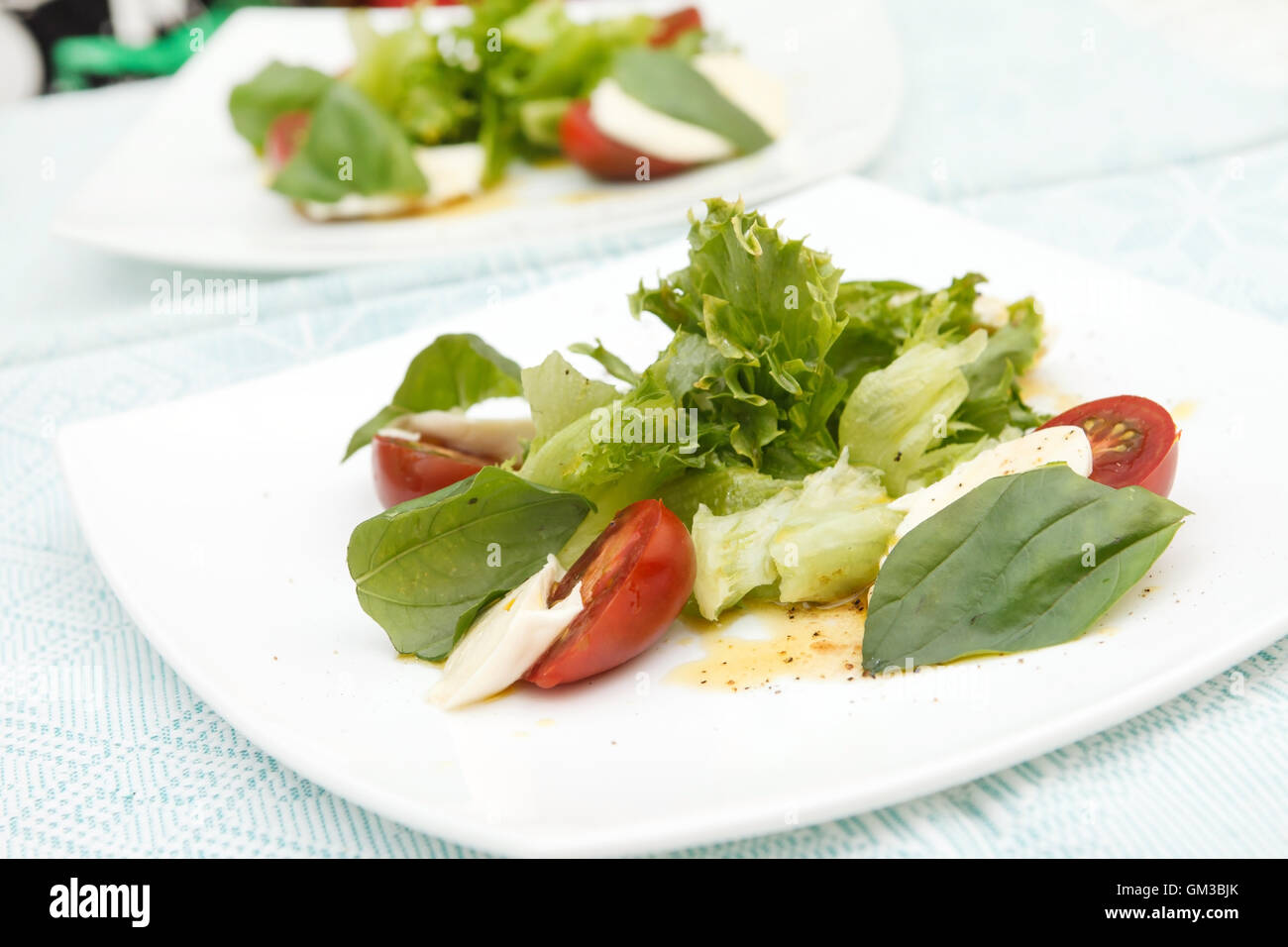 salad with mozzarella, tomatoes and basil Stock Photo