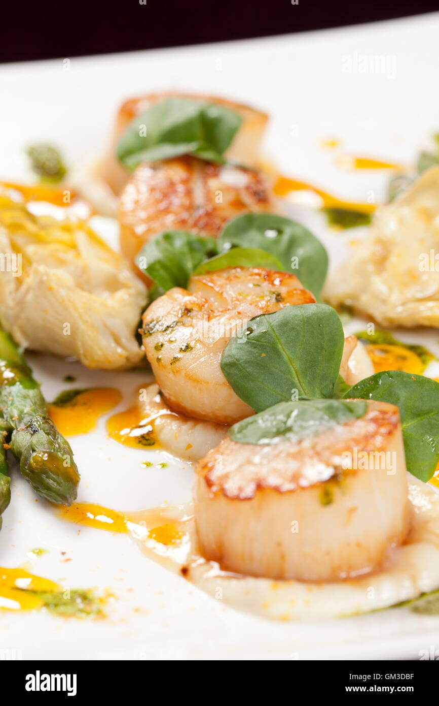Baked scallops with asparagus Stock Photo Alamy