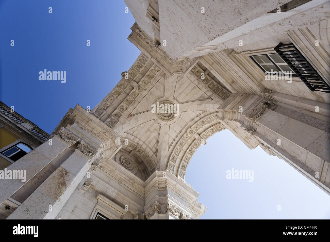 Upwards view of the Rua Augusta Arch, a stone triumphal arch-like historical building and main attraction on the Praca do Comerc Stock Photo