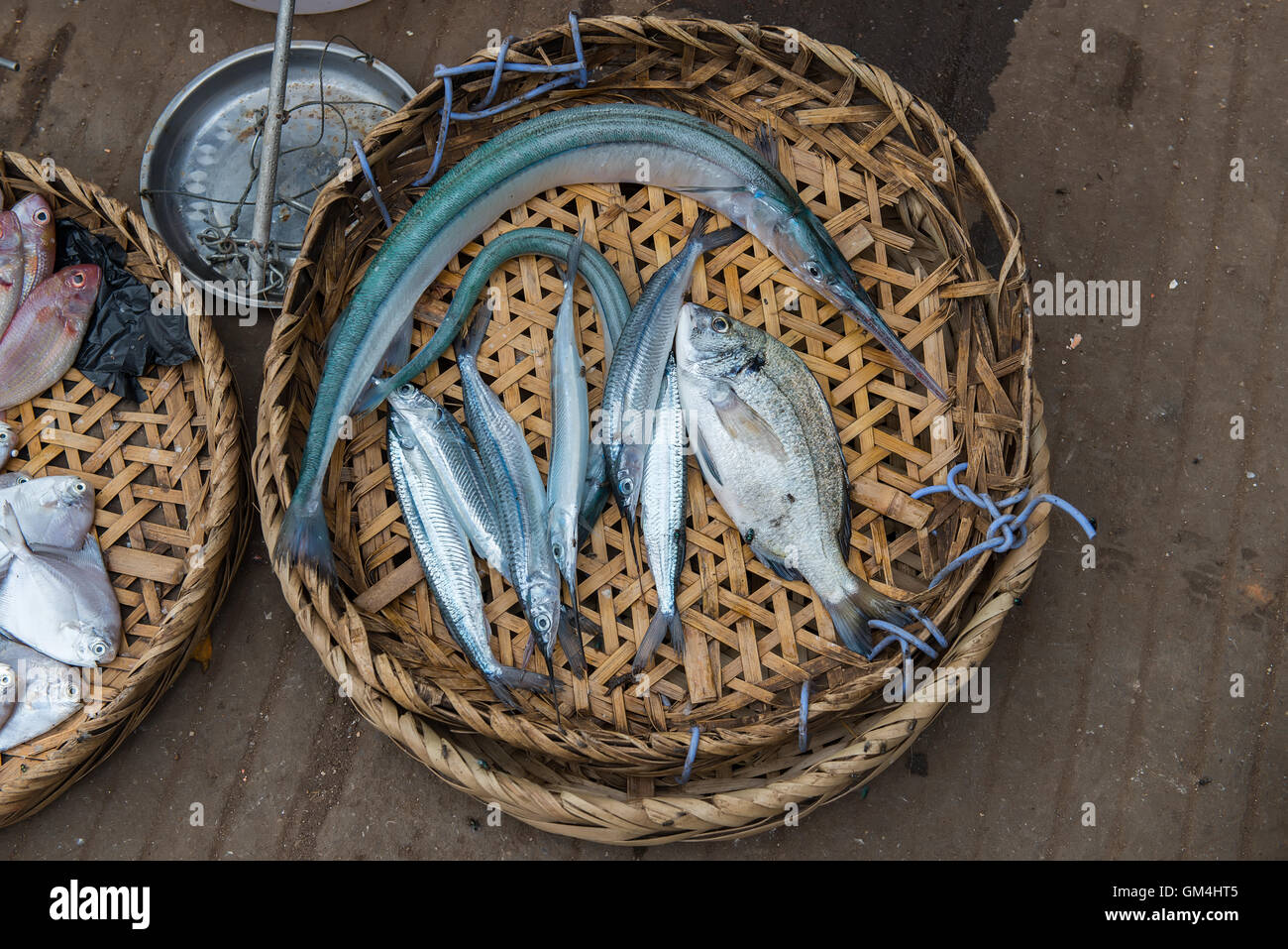 Fresh fish in market. Fish sale in bamboo tray bask display for customer  Stock Photo - Alamy