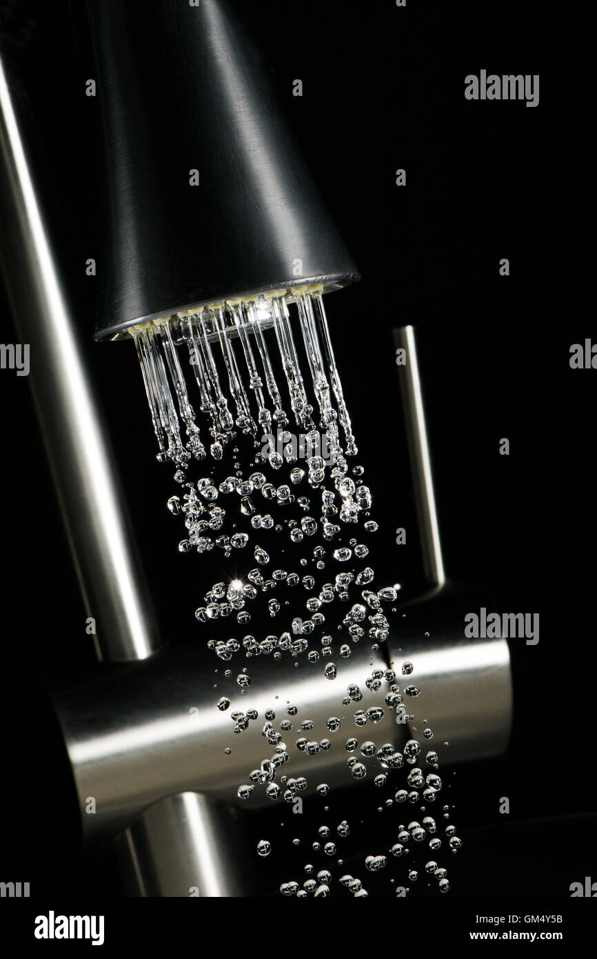 highspeed image - droplets out of a water crane Stock Photo