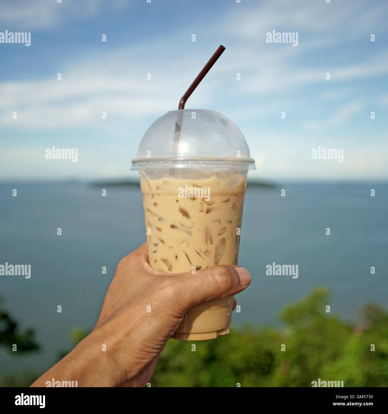 Plastic cup of cold coffee on white background Stock Photo - Alamy