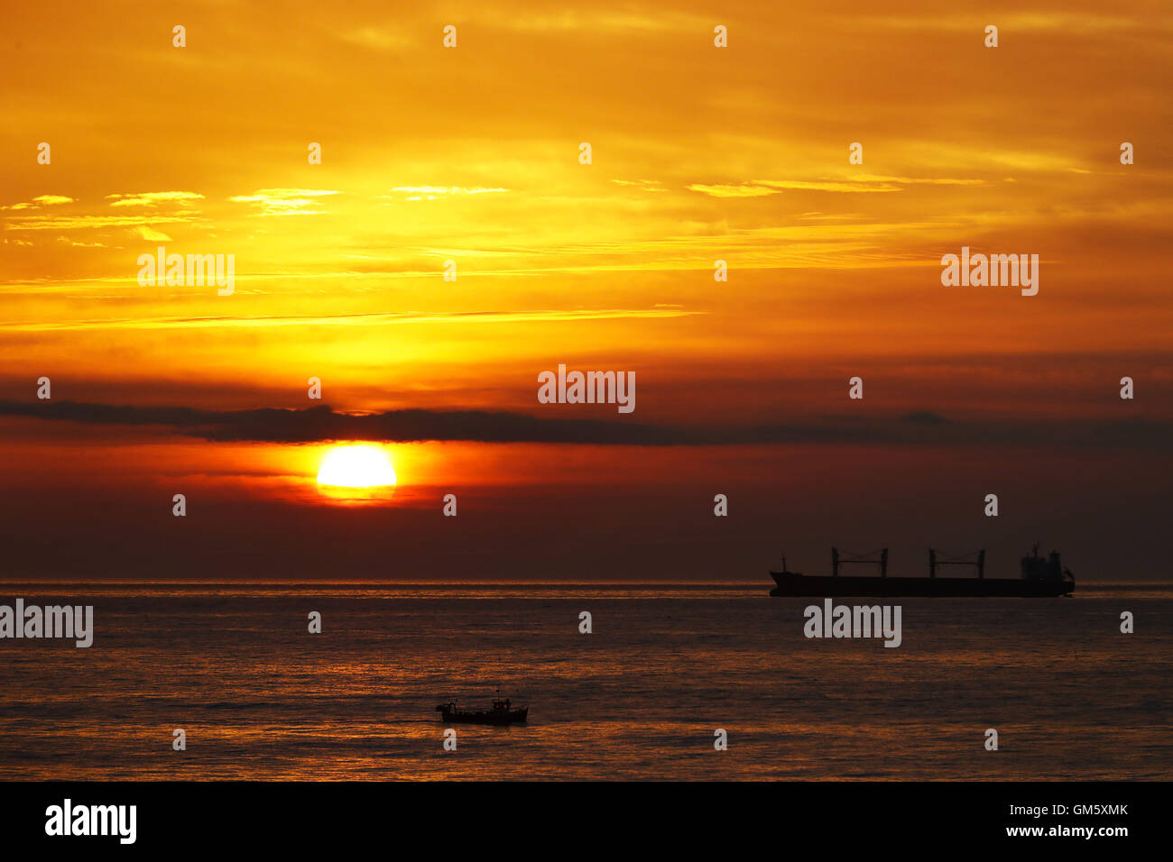 Sunrise over the North Sea at Tynemouth, as a heatwave was set to cause parts of the country to sizzle. Stock Photo