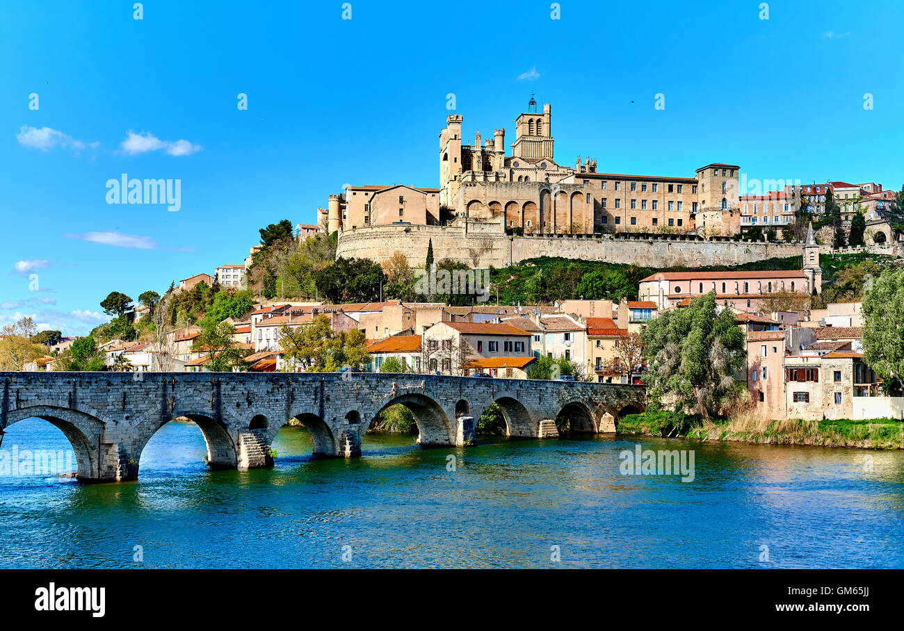 The old Arch Bridge and cathedral Saint-Nazaire in the Beziers town Stock Photo