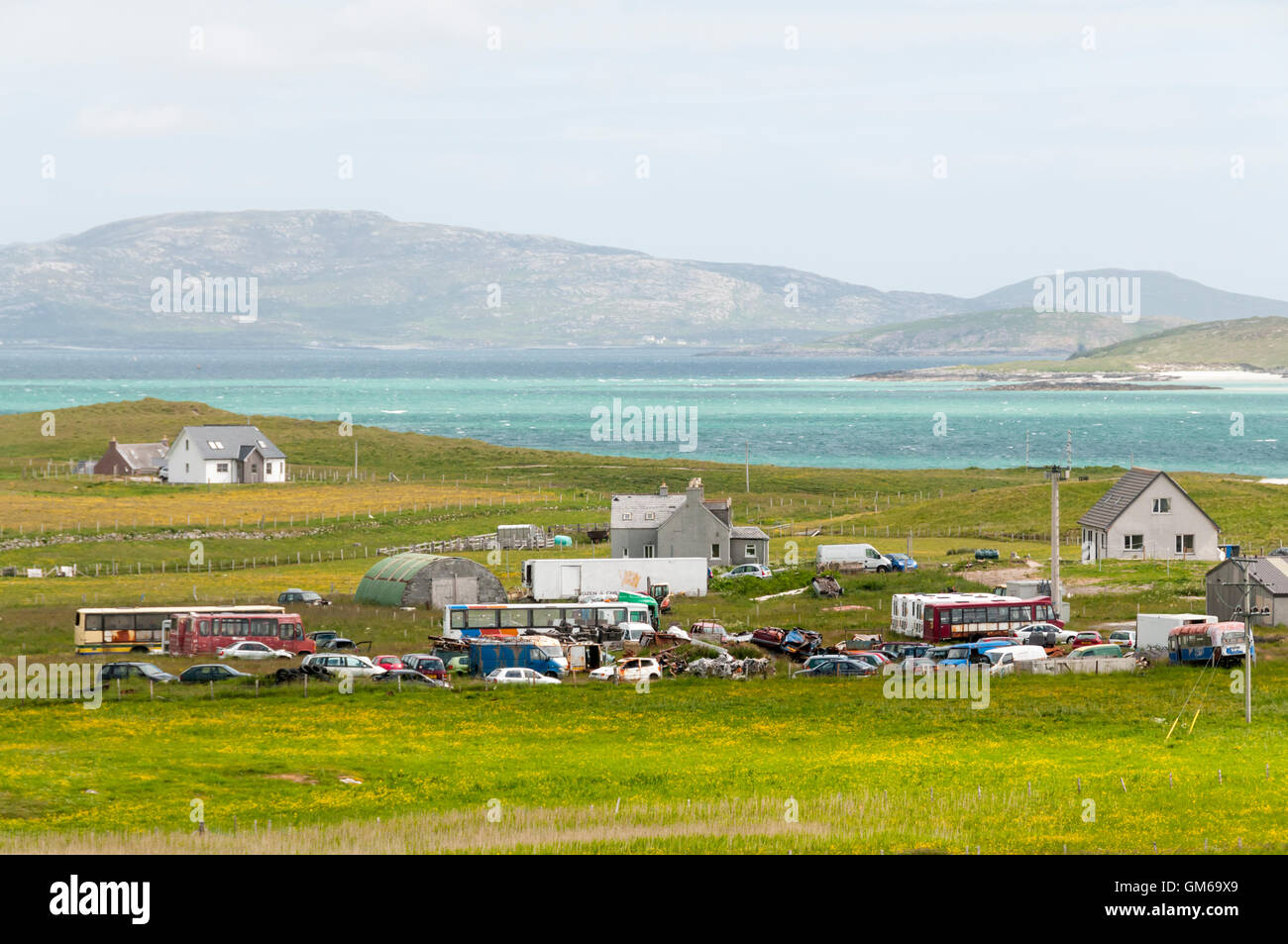 Old vehicles at Eoligarry in the north of the Isle of Barra in the Outer Hebrides. Stock Photo