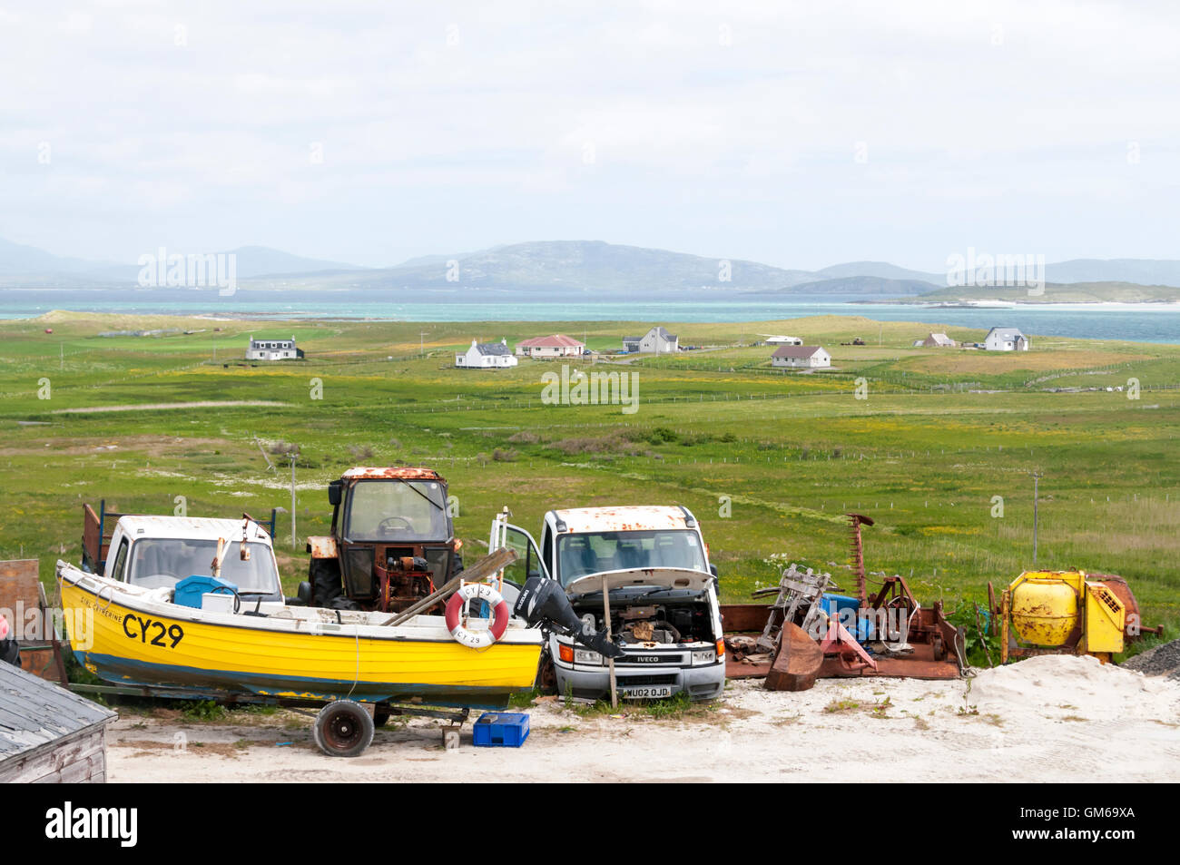 Old vehicles at Eoligarry in the north of the Isle of Barra in the Outer Hebrides. Stock Photo