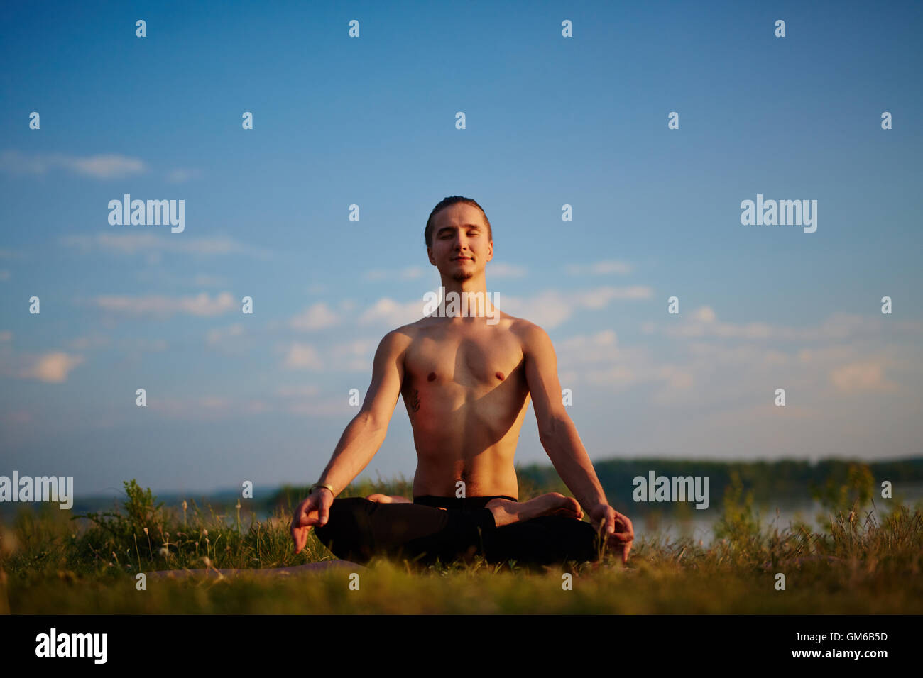 Yoga outdoors Stock Photo
