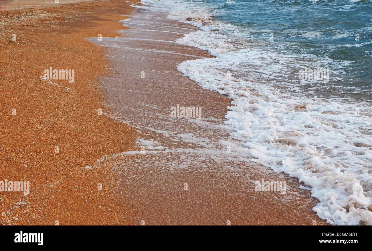 Waves crashing on sandy shore hi-res stock photography and images - Alamy