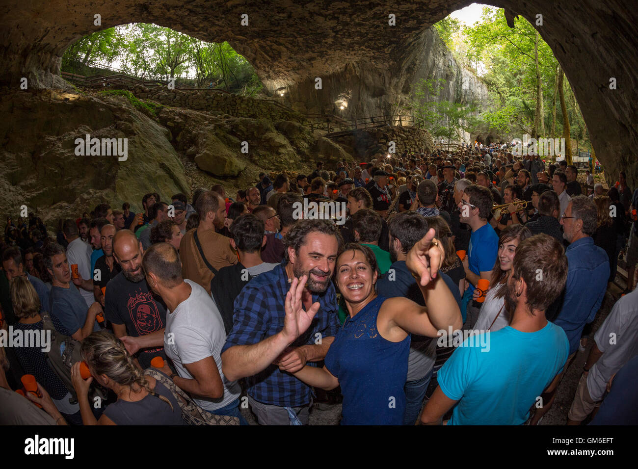 'Zikiro Jate' traditional party in the cave of the witches (Zugarramurdi Navarre Spain) Man and woman having fun. Crowd. Crowded Stock Photo