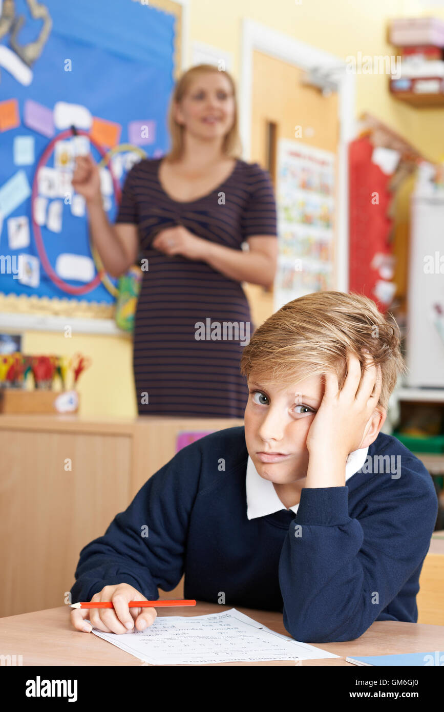 Male Elementary School Pupil Struggling In Class Stock Photo - Alamy