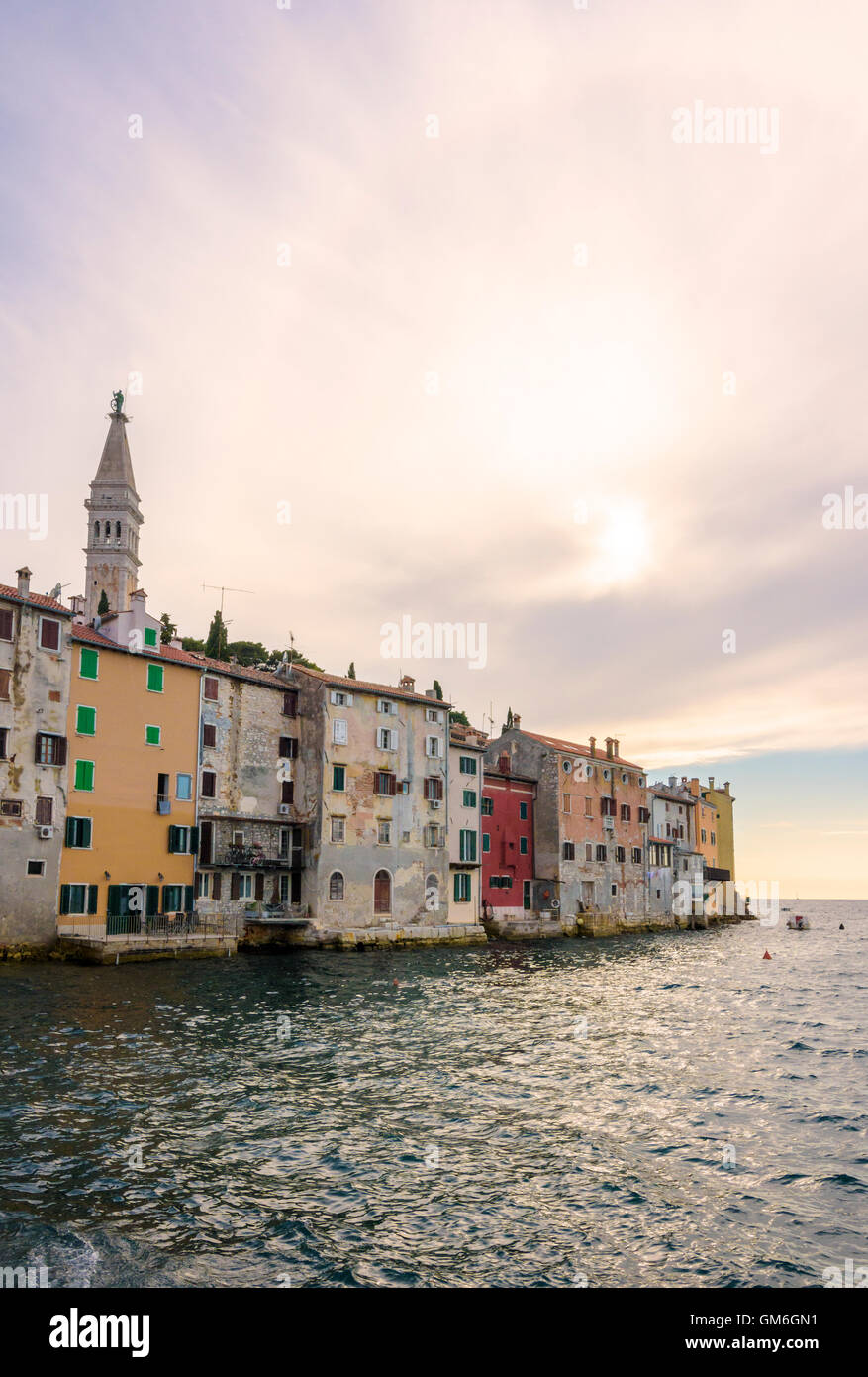 Late afternoon sun shines over the weathered colourful buildings of old Rovinj Town, Rovinj, Istria, Croatia Stock Photo