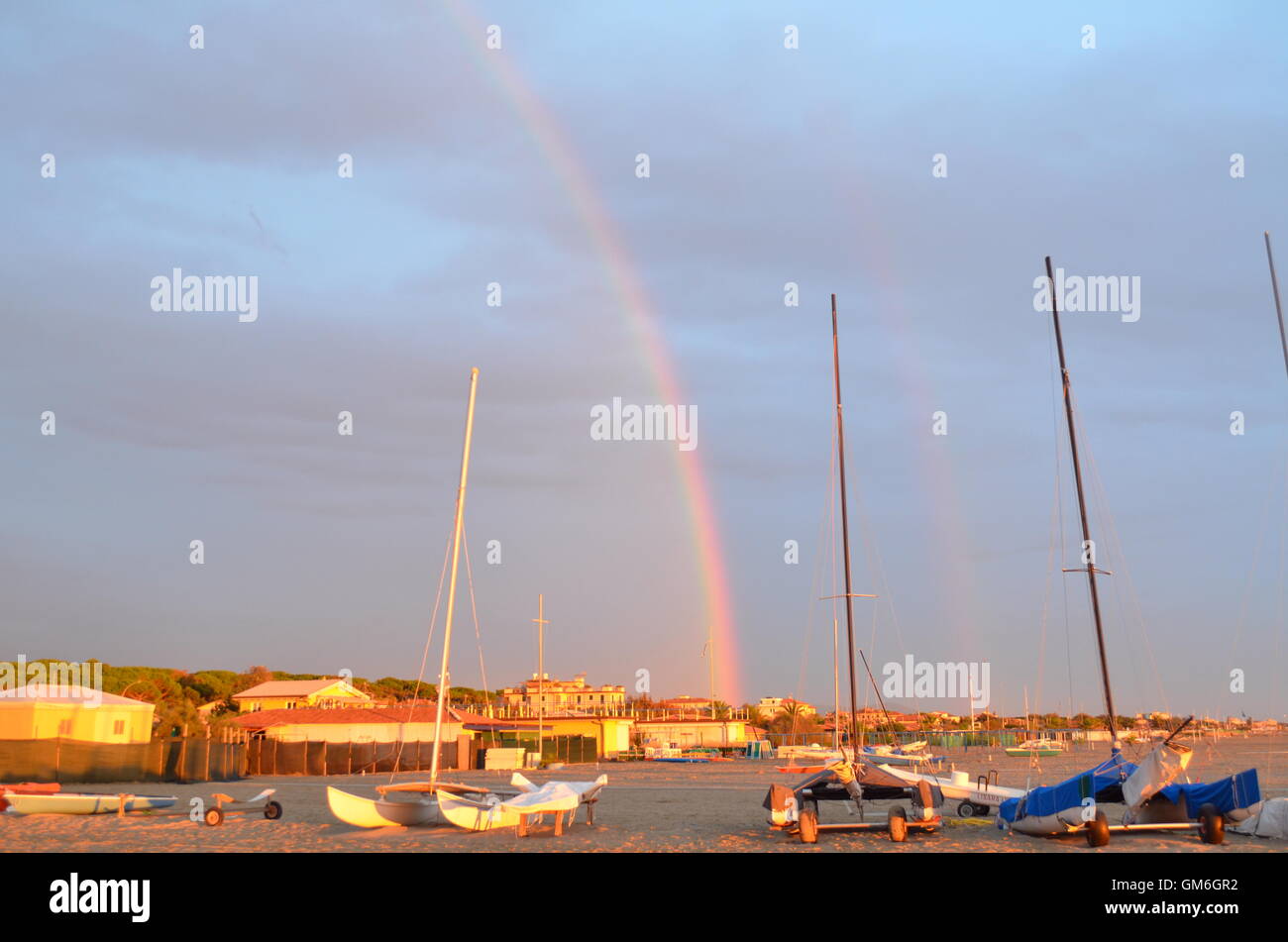 Rainbow is displayed across a sky after the storm Stock Photo