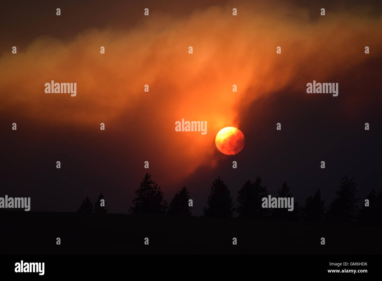 Smoke filled sunset. Stock Photo