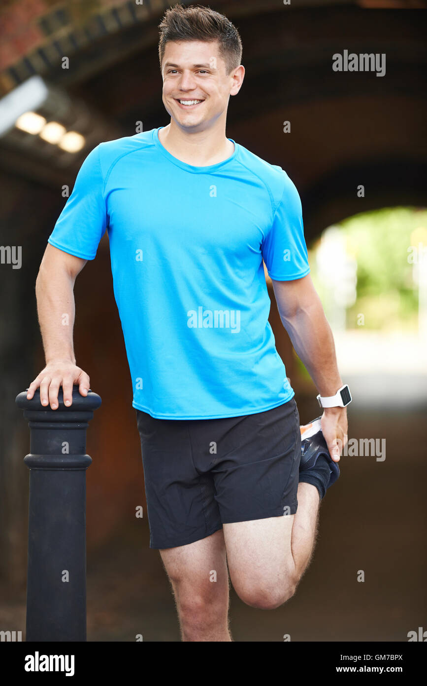 Young man stretching hi-res stock photography and images - Alamy
