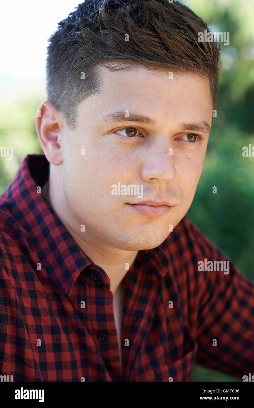 Head And Shoulders Portrait Of Concerned Man Stock Photo
