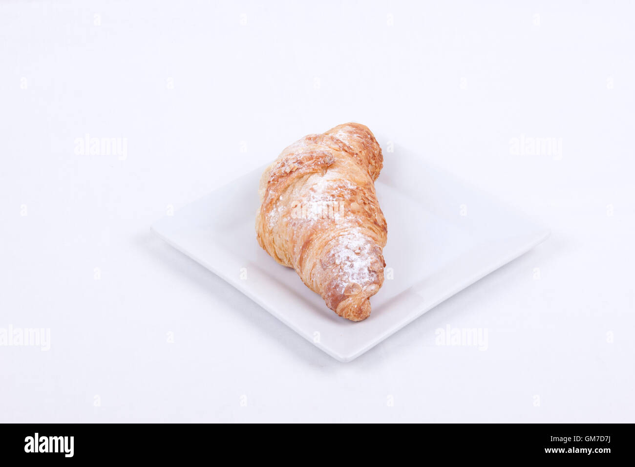 fresh almond croissant on a white background Stock Photo - Alamy