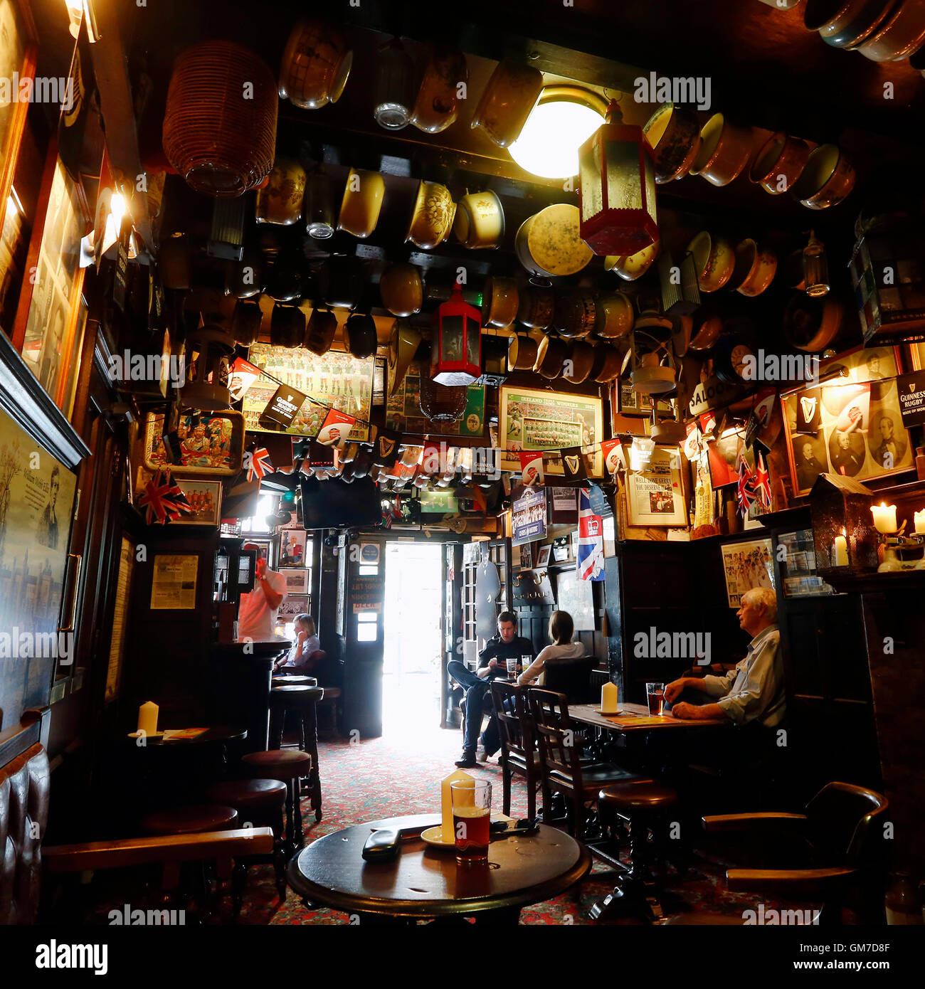London, UK - May 7, 2016: Inside view of a public house, known as pub, for drinking and socializing, is the focal point of the c Stock Photo