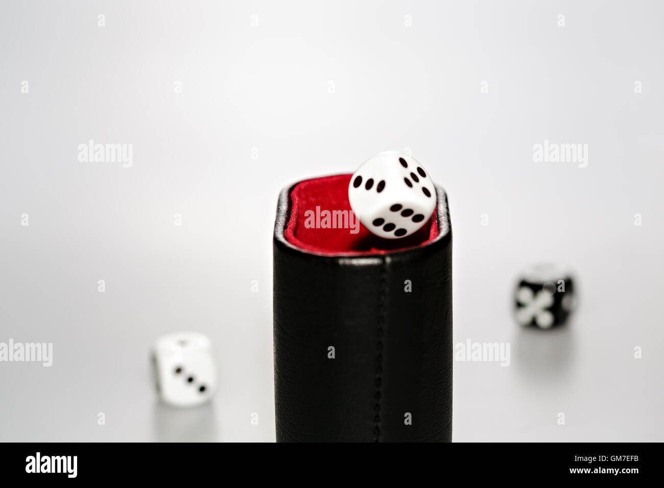 A dice with dice cup Stock Photo Alamy
