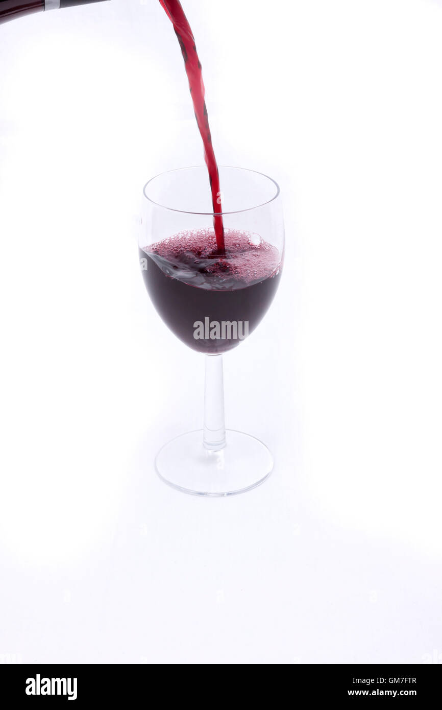 A glass of red wine on white background Stock Photo - Alamy