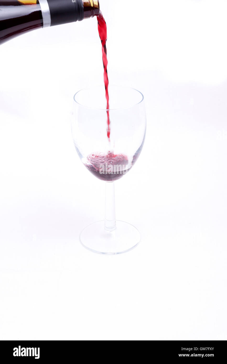 A glass of red wine on white background Stock Photo - Alamy