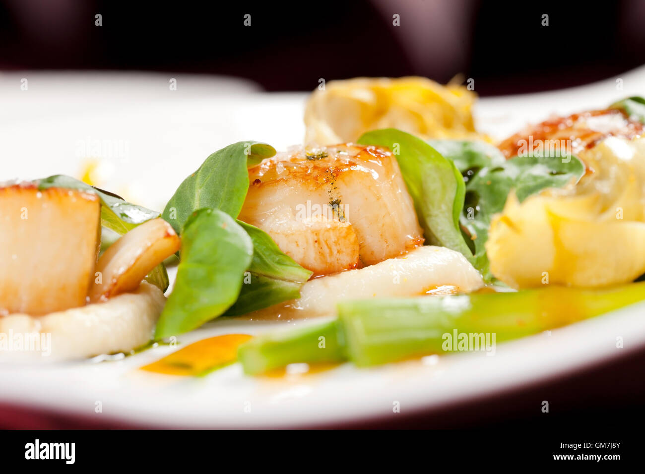 Baked scallops with asparagus Stock Photo Alamy
