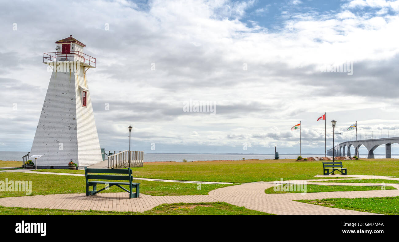 Lighthouse in the park. Warm muggy day in PEI. New Brunswick Confederation Bridge in distance