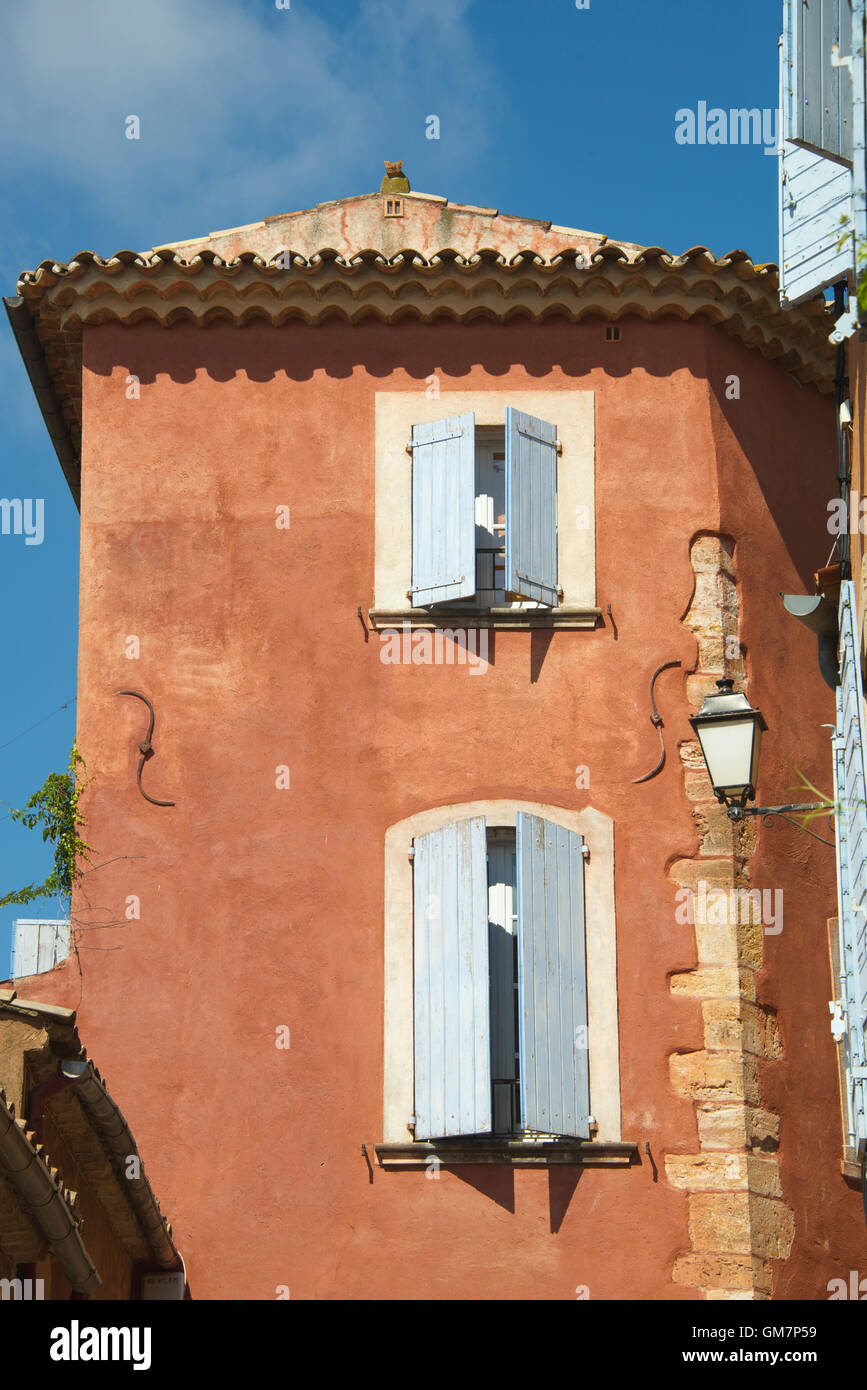House with shutters hilltop village of Roussillon Luberon Provence France Stock Photo