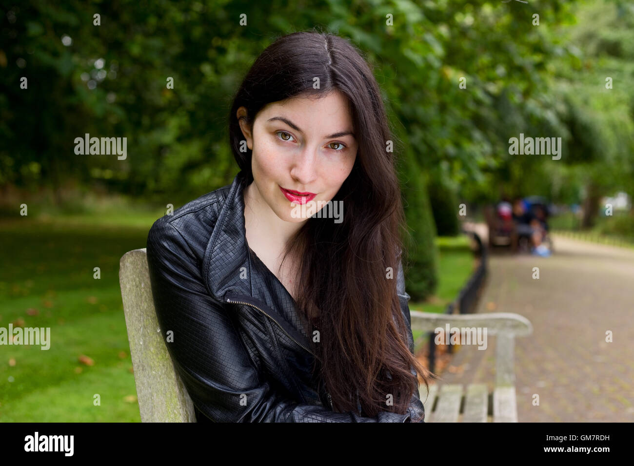 portrait of a young woman in the park Stock Photo - Alamy
