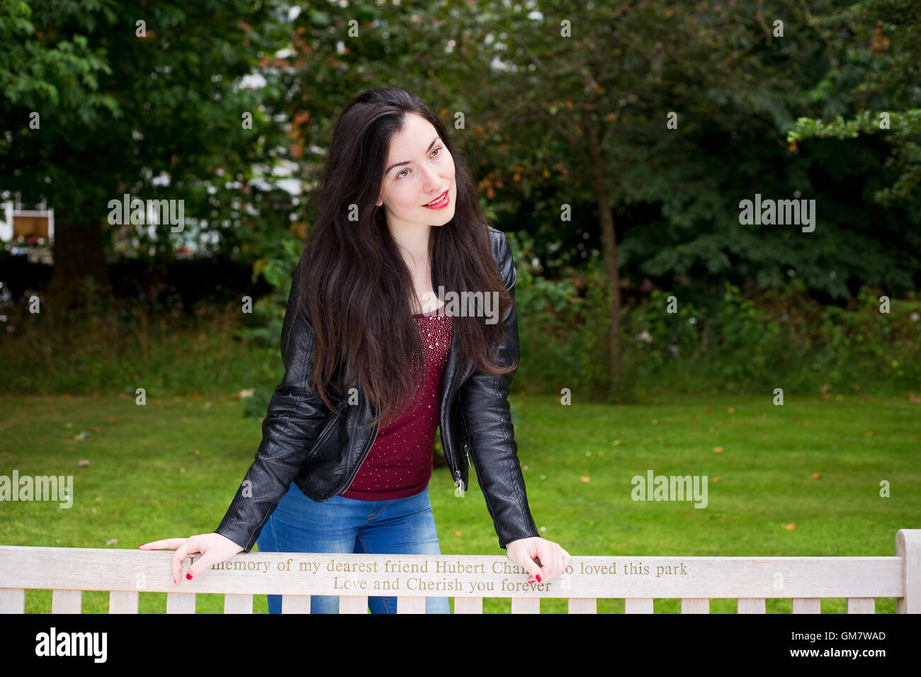 portrait of a young woman in the park Stock Photo - Alamy
