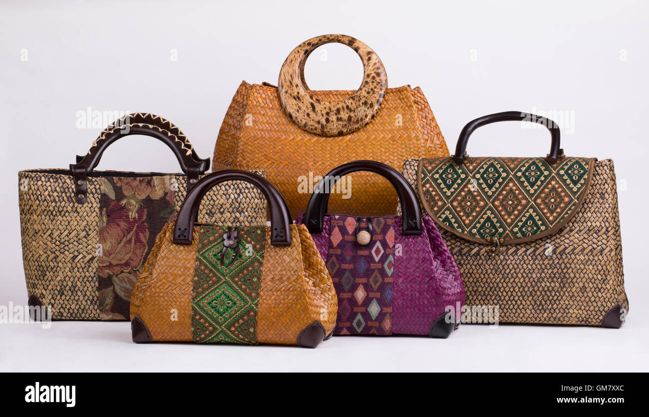 Set of beautiful wicker women handbags isolated on white background Stock Photo