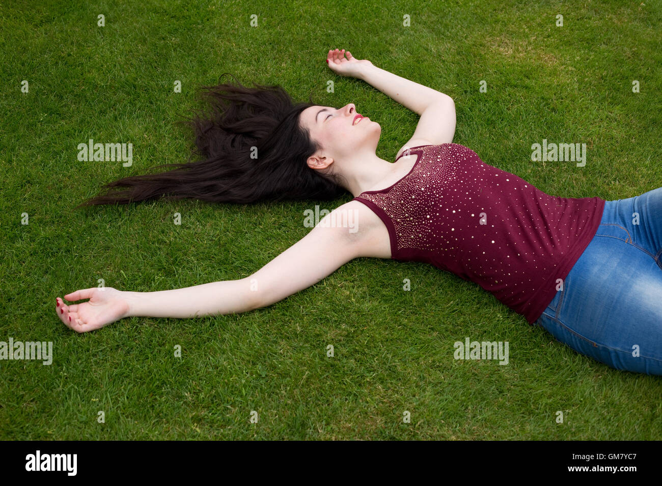 young woman relaxing in the park Stock Photo - Alamy