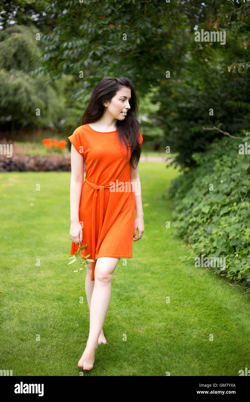 Woman walking barefoot grass garden hi-res stock photography and images ...