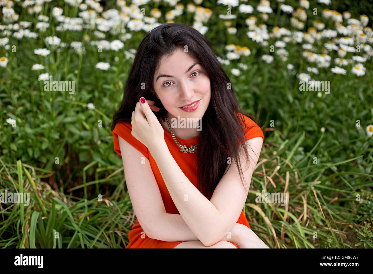 Woman sitting relaxed hi-res stock photography and images - Alamy