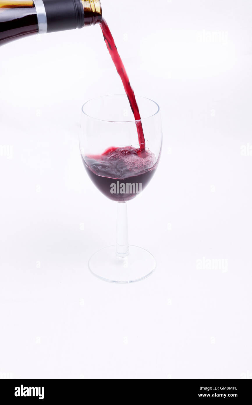 A glass of red wine on white background Stock Photo - Alamy