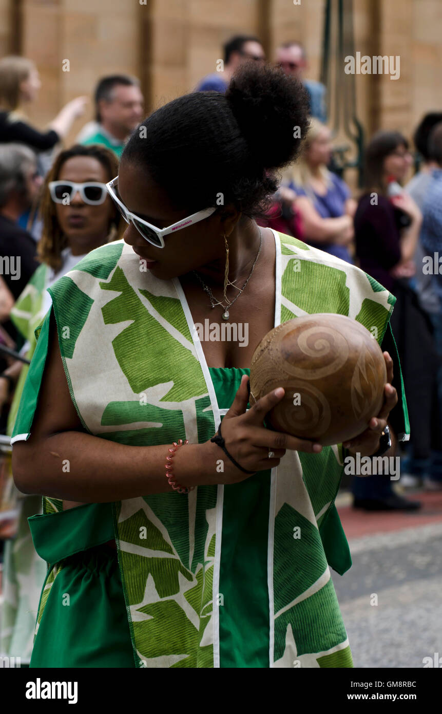 Black African female percussionist taking part in the Cavalcade, part
