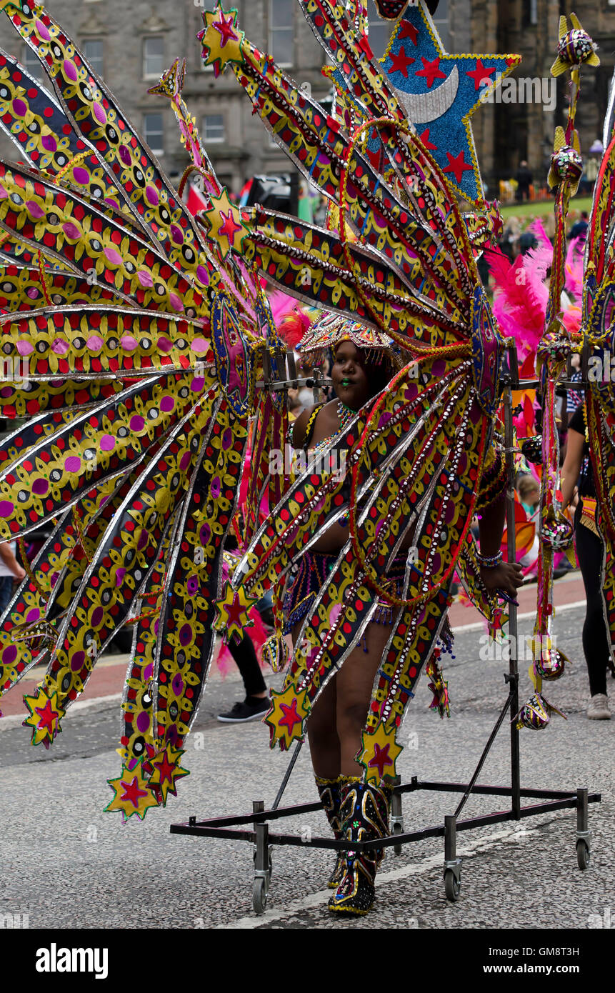 Black woman with an ornate costume supported by castors taking part in the Cavalcade, part of the Edinburgh Jazz Festival. Stock Photo