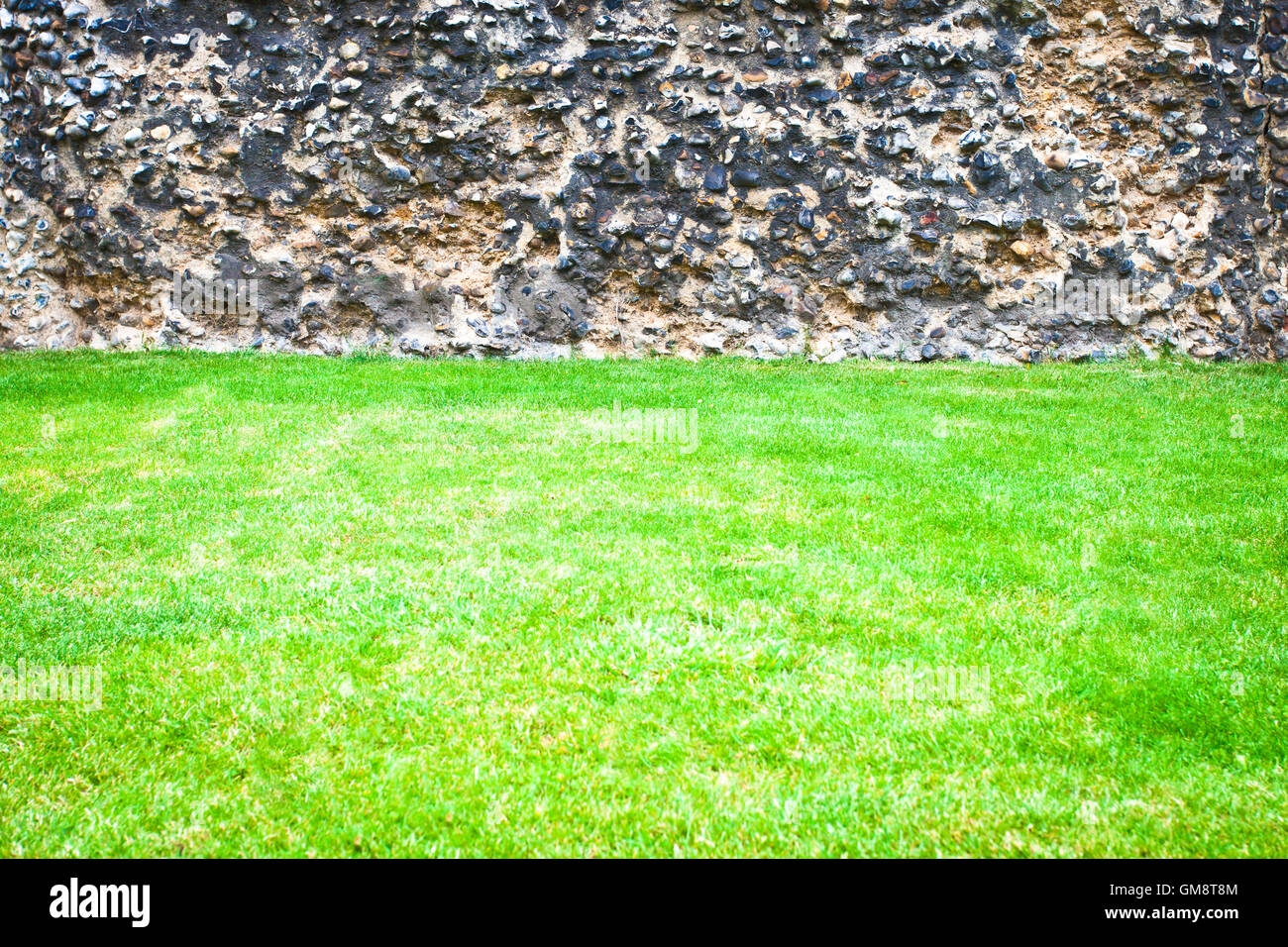 Grass and stone wall Stock Photo - Alamy